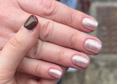 Glittering nail polish design at Beauty By Chloe, Leeds, England, GB showcasing elegant manicure.