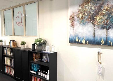 Serene interior of Blue Mountains Therapies in Katoomba, New South Wales, AU with art and book display.