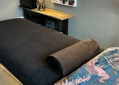 Cozy massage room at Forever Young Beauty, Tongham, England, GB, featuring a plush relaxation bed.