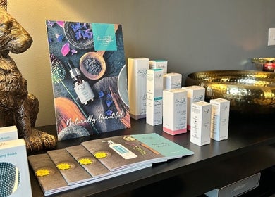 Assorted beauty products at Forever Young Beauty, Tongham, England, GB, displayed elegantly on a table.