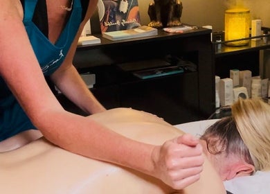 Massage therapy session at Forever Young Beauty in Tongham, England, GB. A serene setting for wellness.