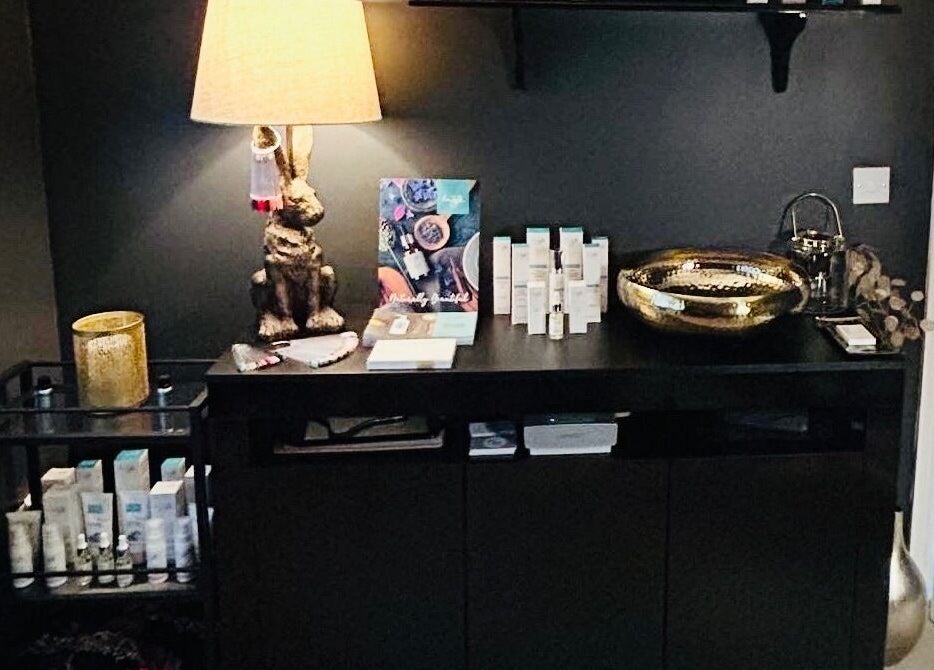 Chic interior at Forever Young Beauty in Tongham, England, GB, featuring products on a modern counter.