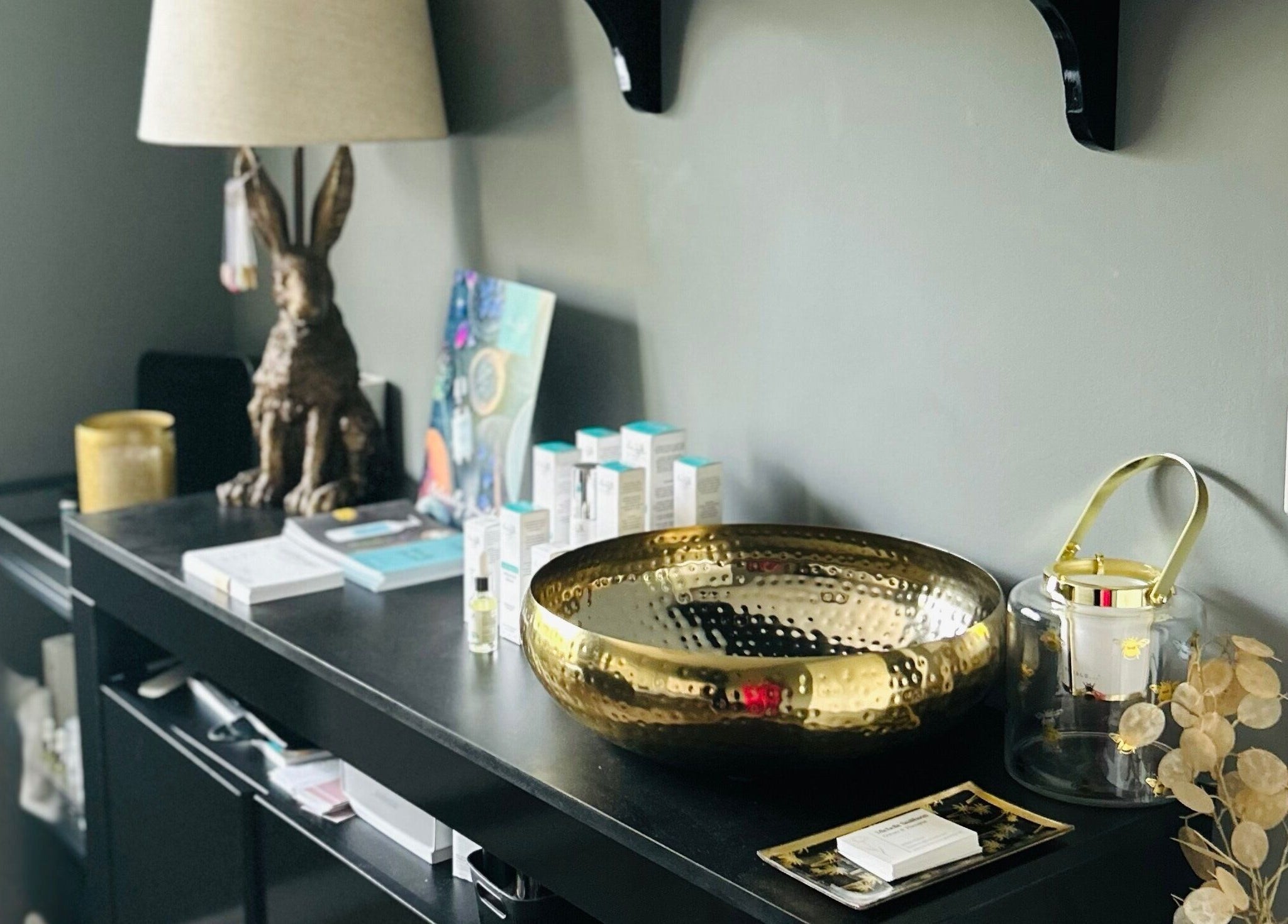 Elegant display with golden bowl at Forever Young Beauty in Tongham, England, GB.