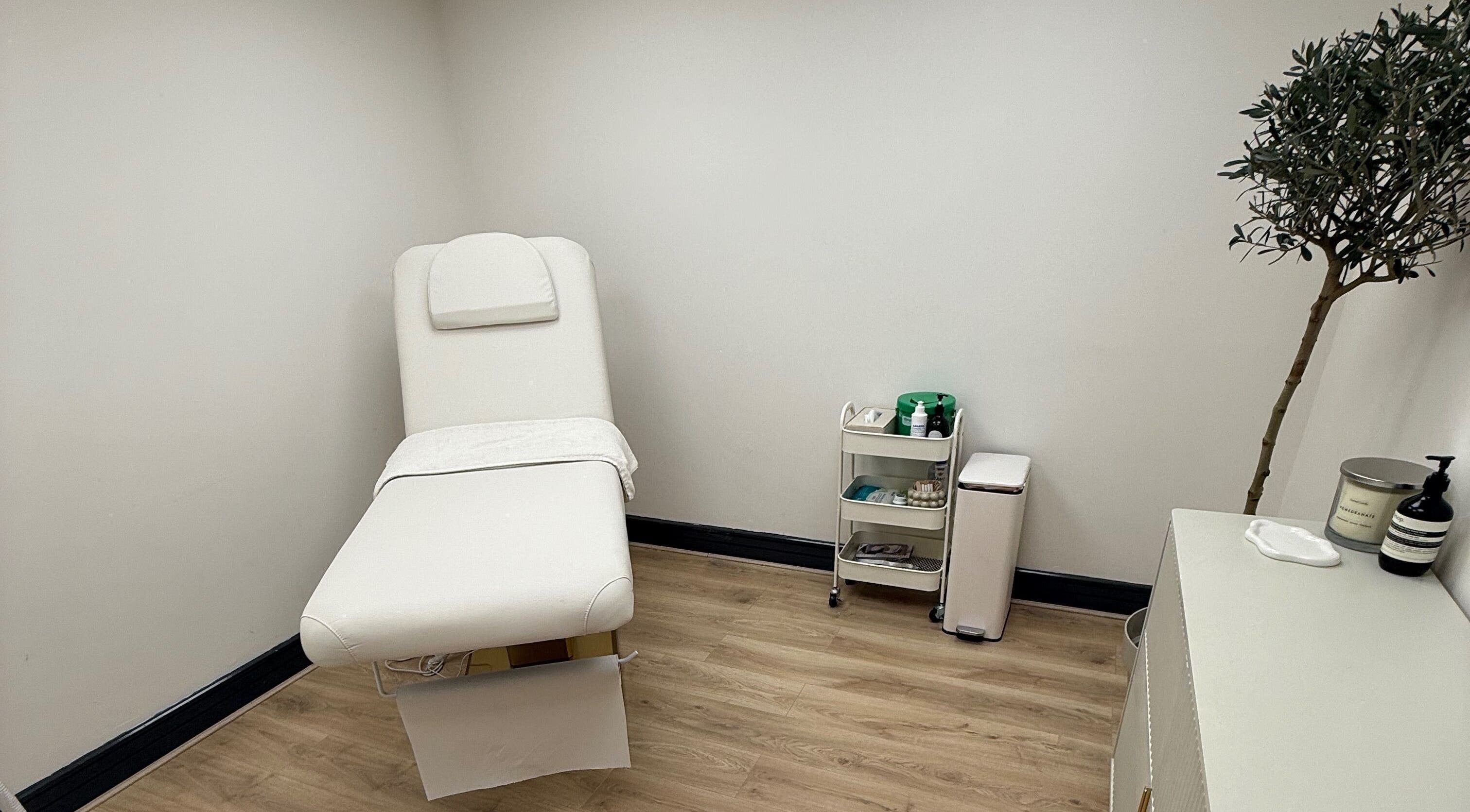 Elegant treatment room at Laser by Lucy, Southend-on-sea, England, GB with a plush white therapy bed.