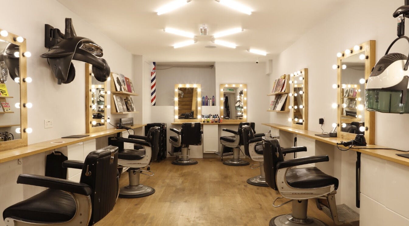 Interior of Sano Hair in London, England, GB with elegant mirrors and styling chairs.