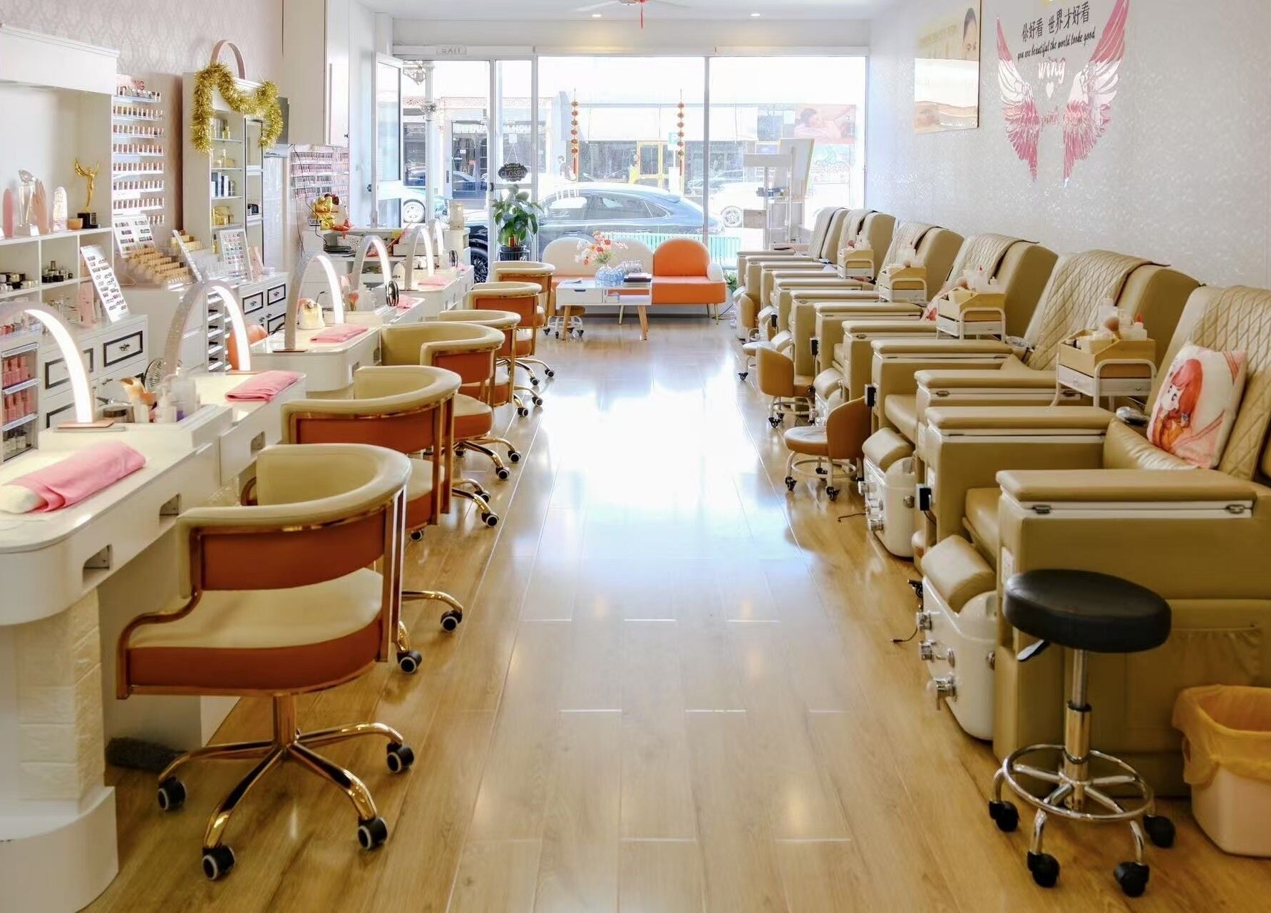 Interior of Renew Beauty Spa in Melbourne, Victoria, AU, showcasing plush pedicure chairs and well-lit manicure stations.