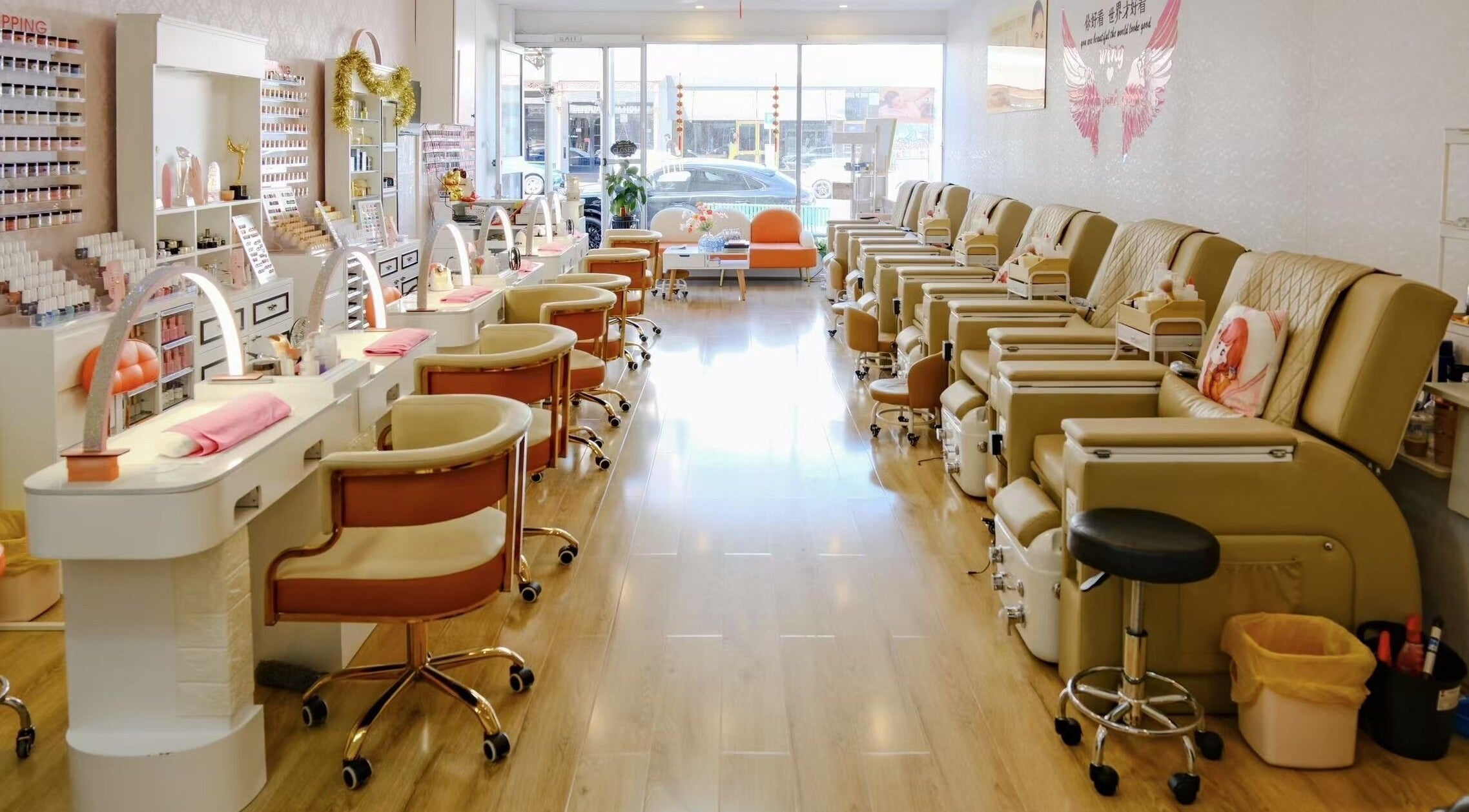Interior of Renew Beauty Spa in Melbourne, Victoria, AU, showcasing plush pedicure chairs and well-lit manicure stations.