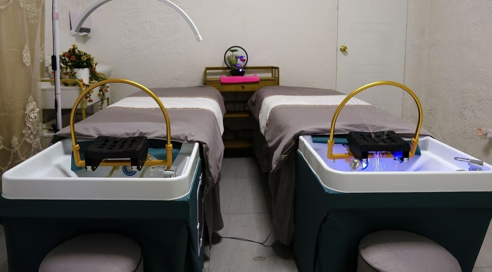 Tranquil spa beds at Renew Beauty Spa, Melbourne, Victoria, AU with elegant decor for a relaxing experience.