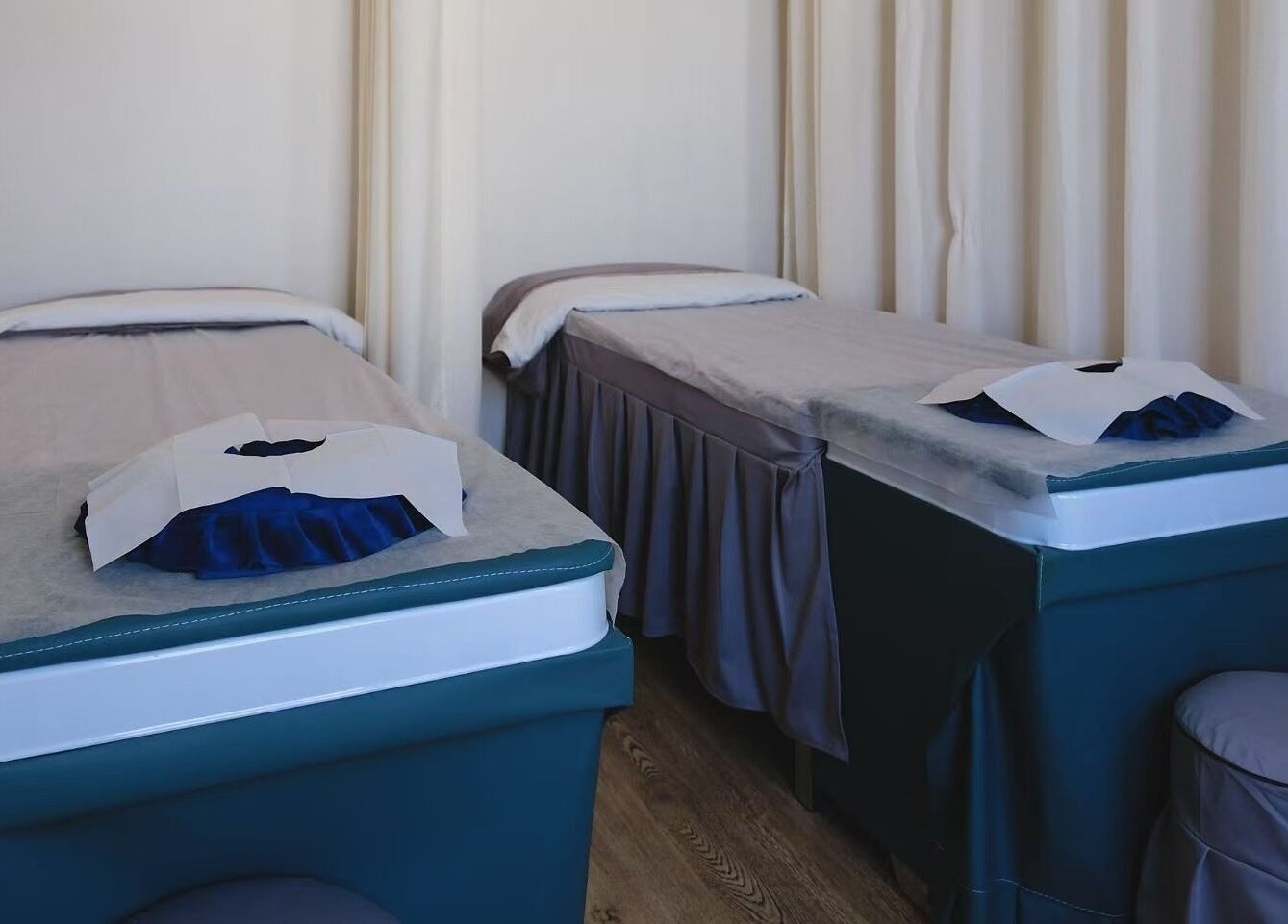 Massage tables in serene room at Renew Beauty Spa, Melbourne, Victoria, AU offer relaxation and comfort.