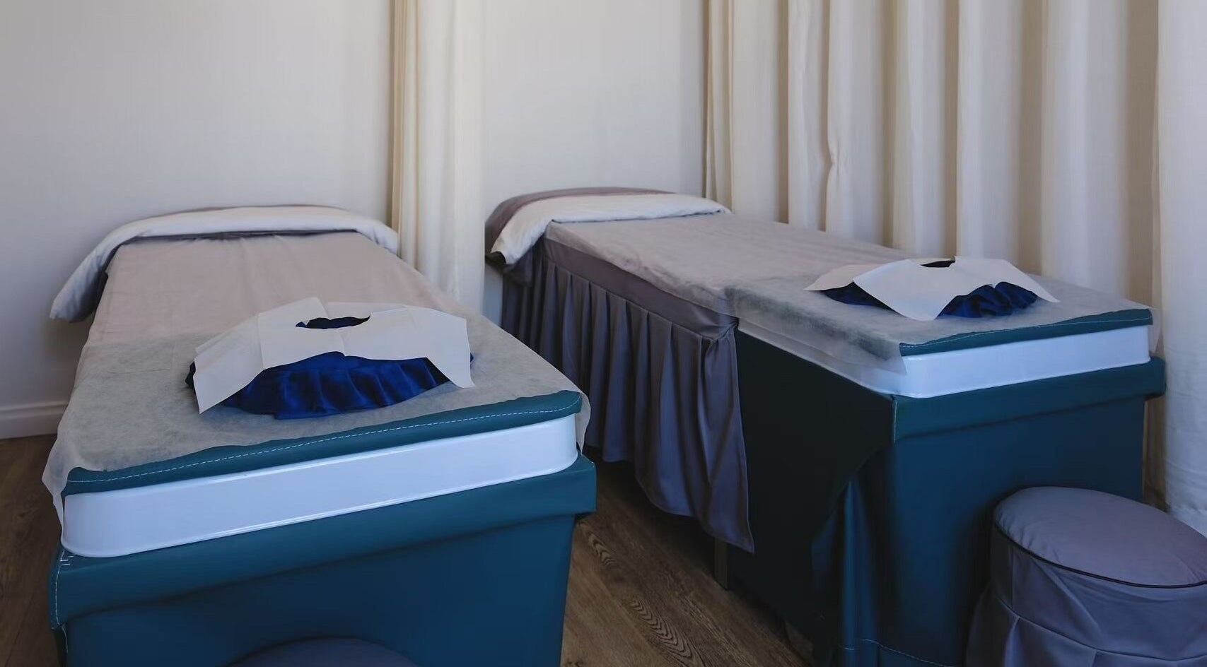 Massage tables in serene room at Renew Beauty Spa, Melbourne, Victoria, AU offer relaxation and comfort.