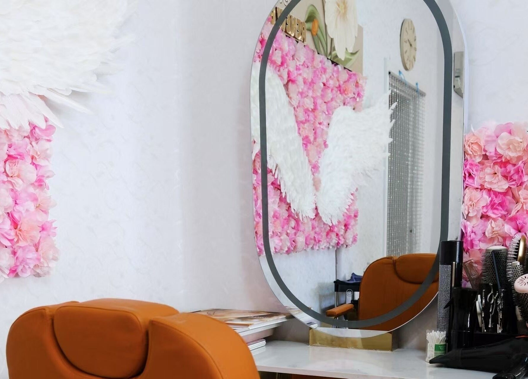 Styled salon mirror at Renew Beauty Spa, Melbourne, Victoria, AU with floral decor and salon tools.