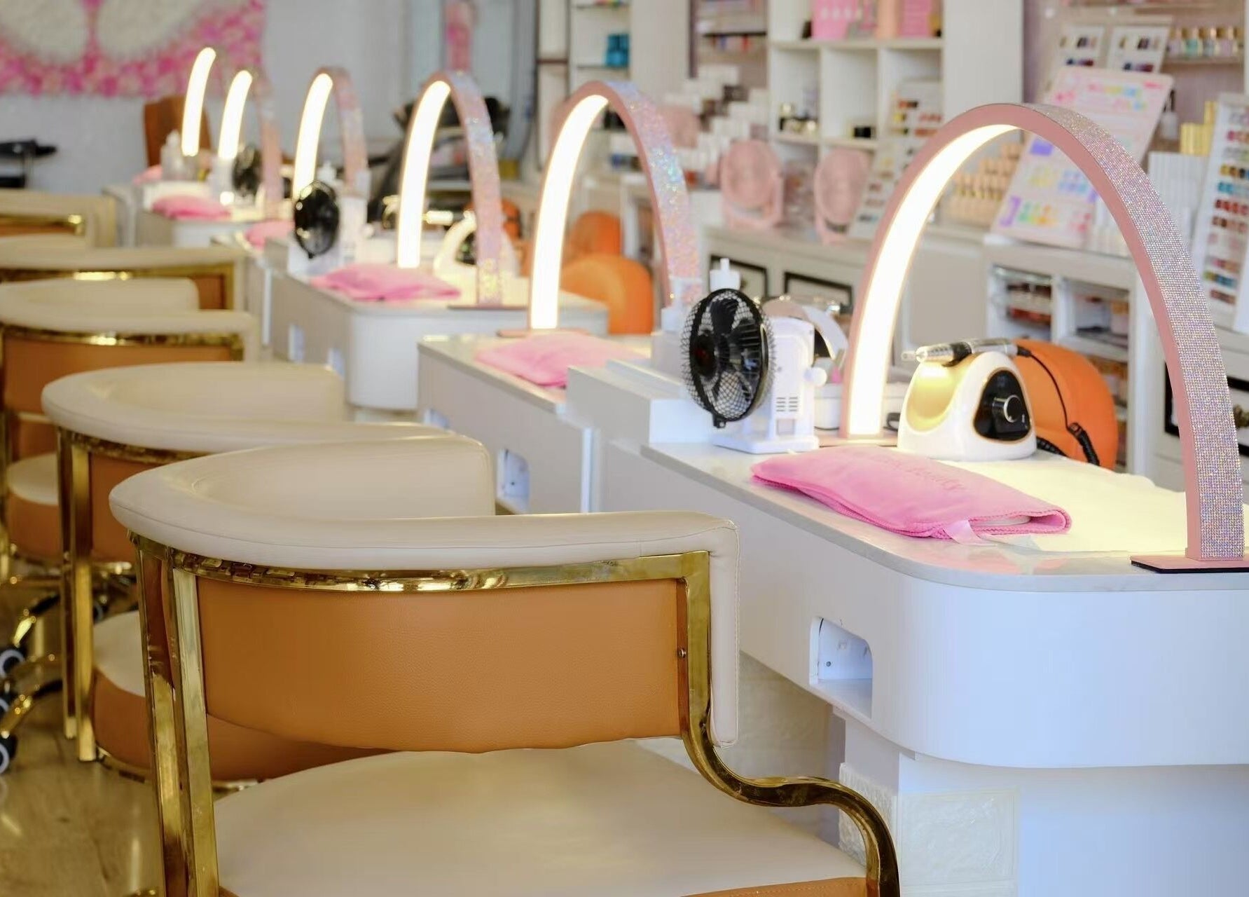 Elegant nail stations at Renew Beauty Spa, Melbourne, Victoria, AU with stylish lighting and seating.
