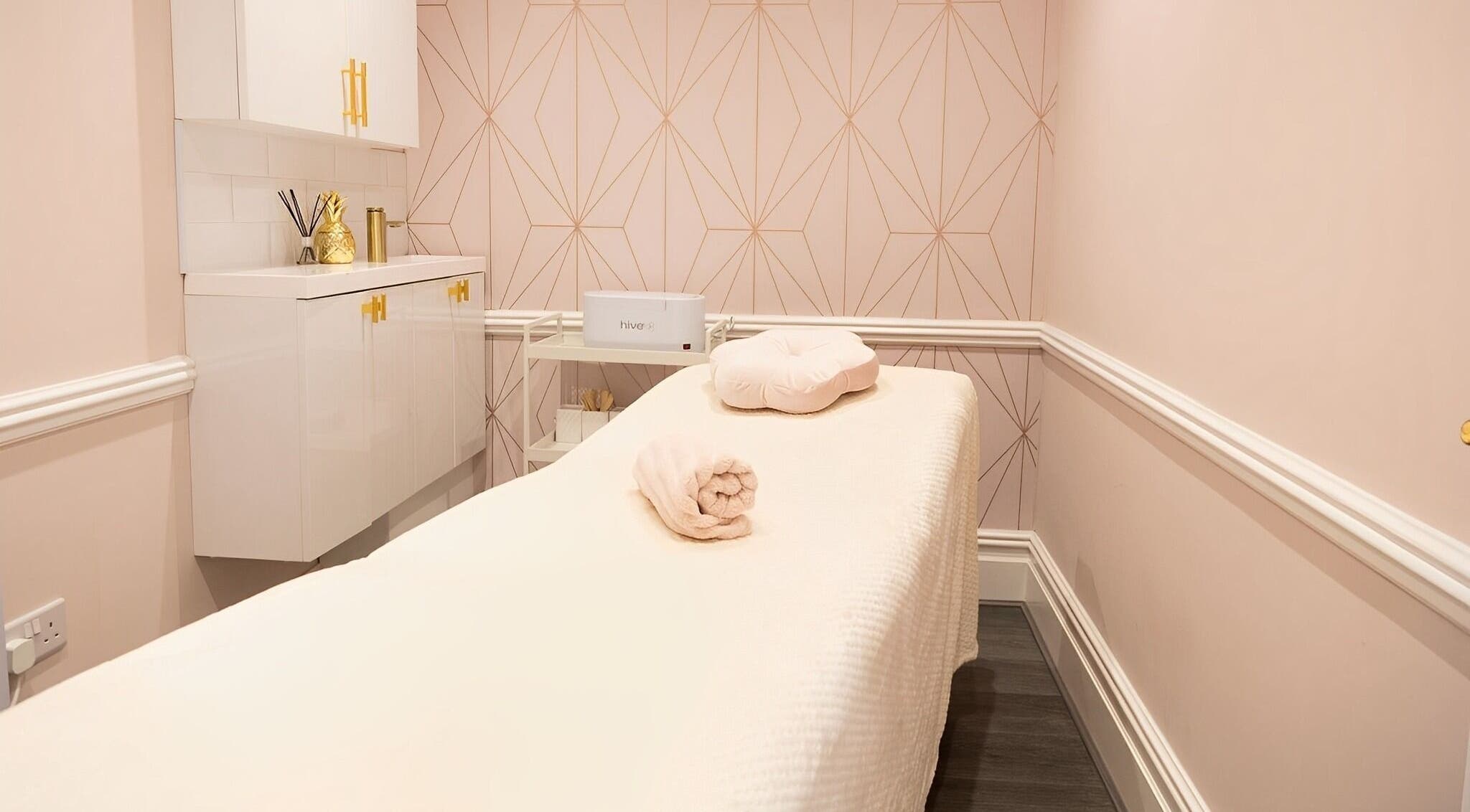 Luxurious treatment room at Clare Armstrong and Co, Menston, England, GB, featuring soft pastels and elegant decor.