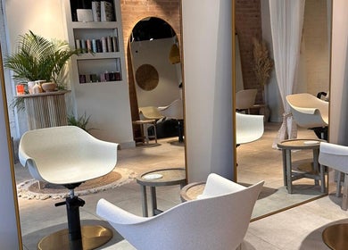 Stylish salon interior at Moss Hair Artistry, Neutral Bay, New South Wales, AU, with modern chairs and mirrors.