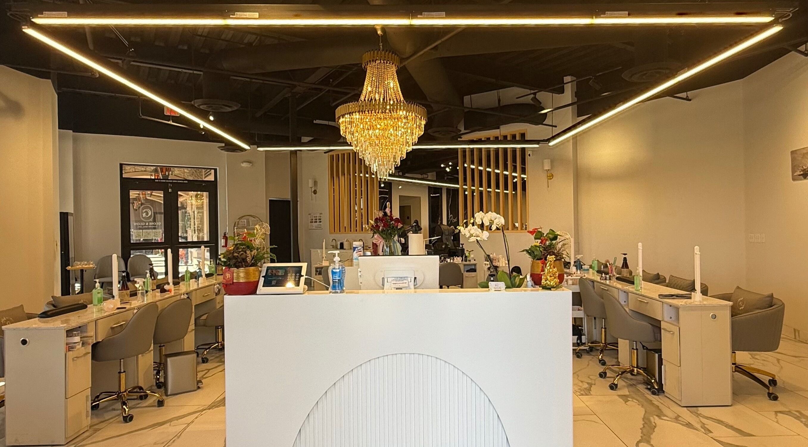 Gloss & Glow Luxury Nail Spa interior with chic chandeliers in Tucson, Arizona, US.