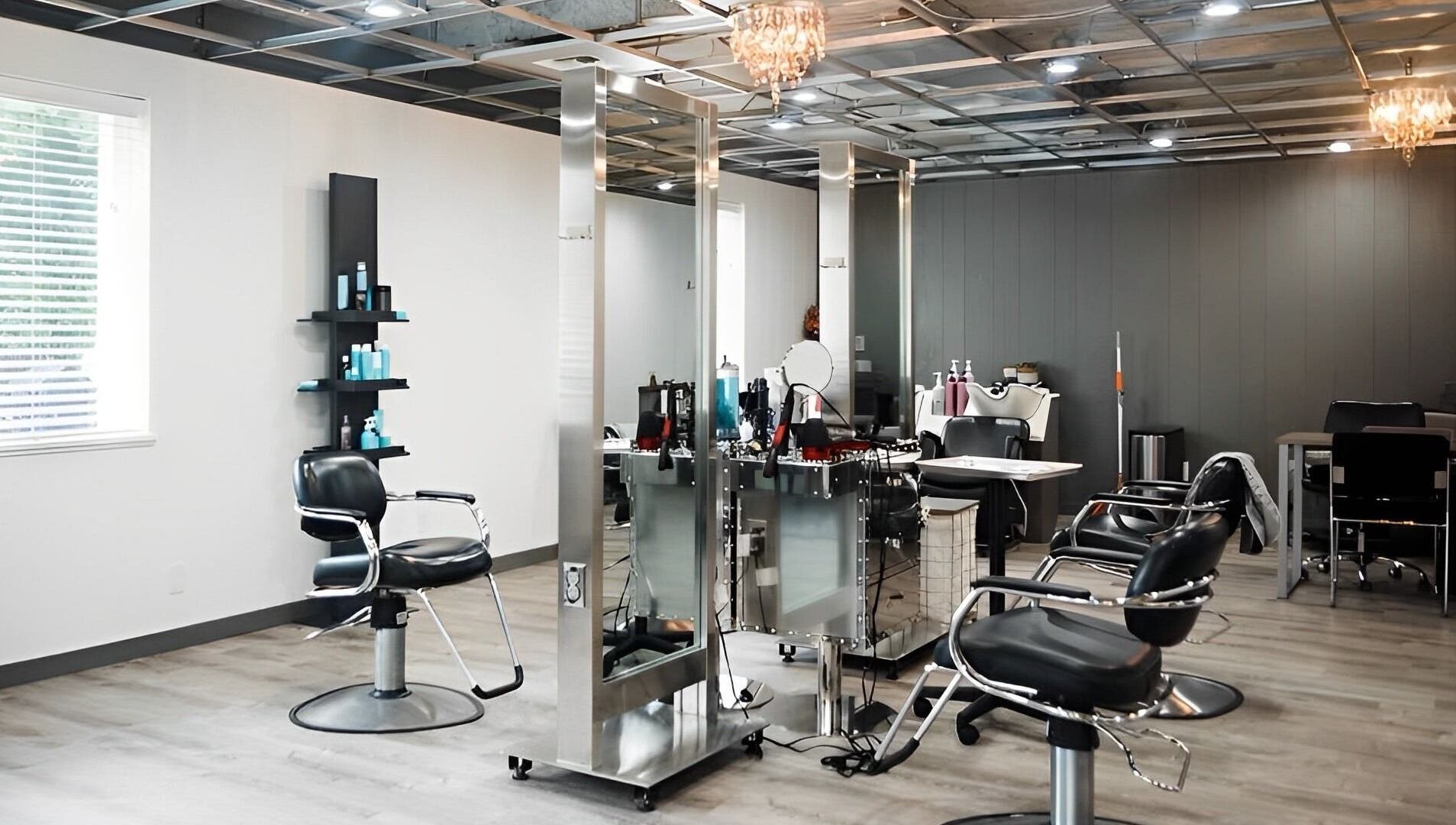 Modern salon interior at Ivy Kae Studio, Valparaiso, Indiana, US, featuring styling stations and sleek design.