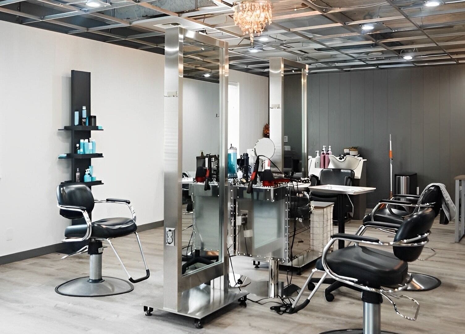 Modern salon interior at Ivy Kae Studio, Valparaiso, Indiana, US, featuring styling stations and sleek design.