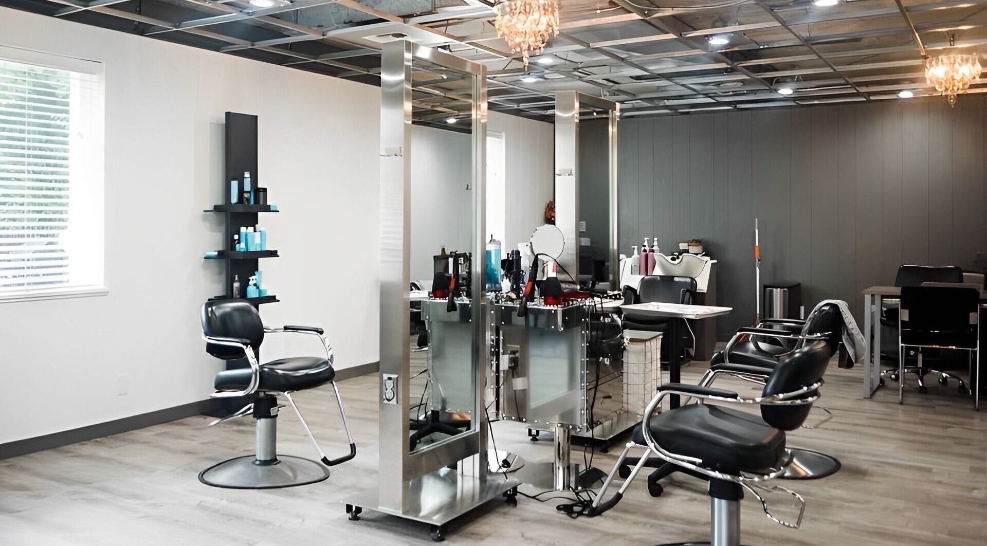 Modern salon interior at Ivy Kae Studio, Valparaiso, Indiana, US, featuring styling stations and sleek design.