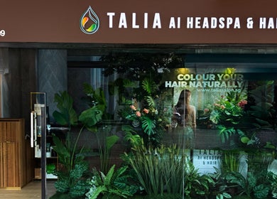 Front view of Talia Hair and Beauty Salon, Singapore, SG, showcasing lush greenery and stylish design.