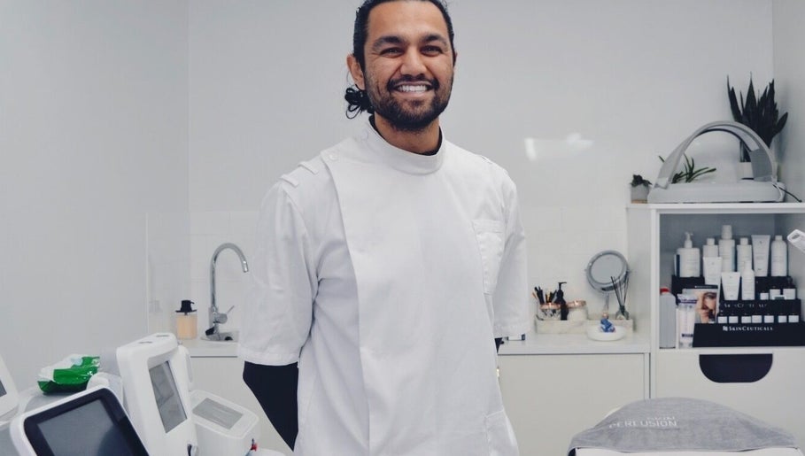 Professional at Mistry Osteopath South Ealing clinic in London, England, GB, surrounded by wellness equipment.