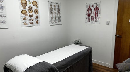 Treatment room at Mistry Osteopath South Ealing, London, England, GB, with anatomical posters.
