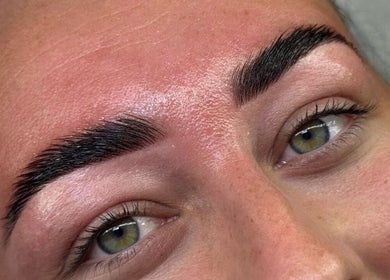 Close-up of perfectly shaped eyebrows at The Lash Lodge, Newry, Northern Ireland, GB. Enhancing natural beauty.