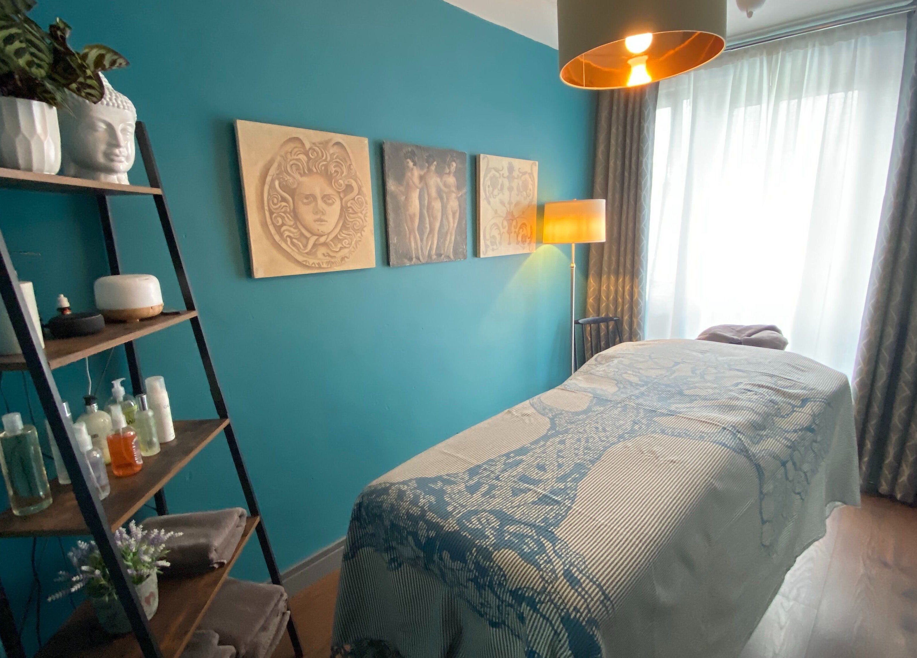 Serene massage room at Yonathan Massage Therapy, London, England, GB with decor and ambient lighting.
