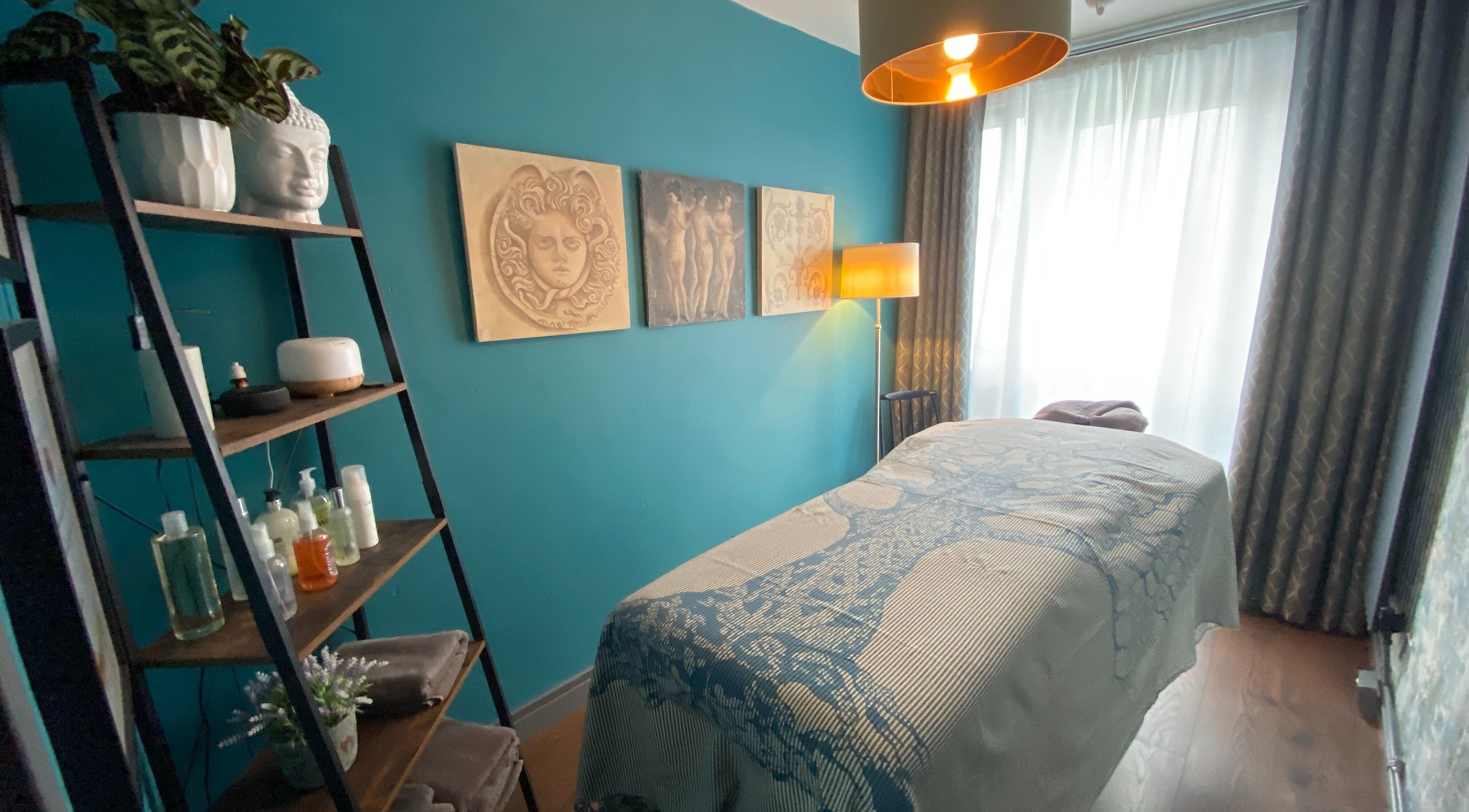 Relaxing massage room at Yonathan Massage Therapy in London, England, GB with calming decor and soft lighting.