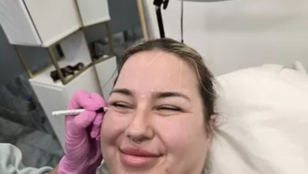 Client enjoying a relaxing facial at Glowtonix, Borehamwood, England, GB.