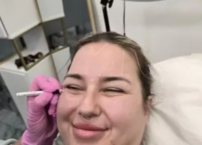 Client enjoying a relaxing facial at Glowtonix, Borehamwood, England, GB.