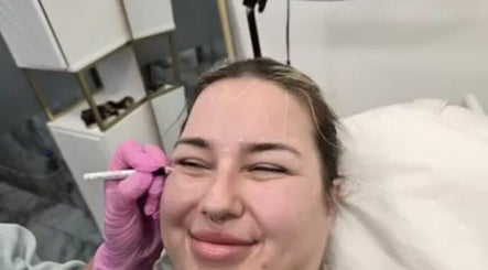 Client enjoying a relaxing facial at Glowtonix, Borehamwood, England, GB.