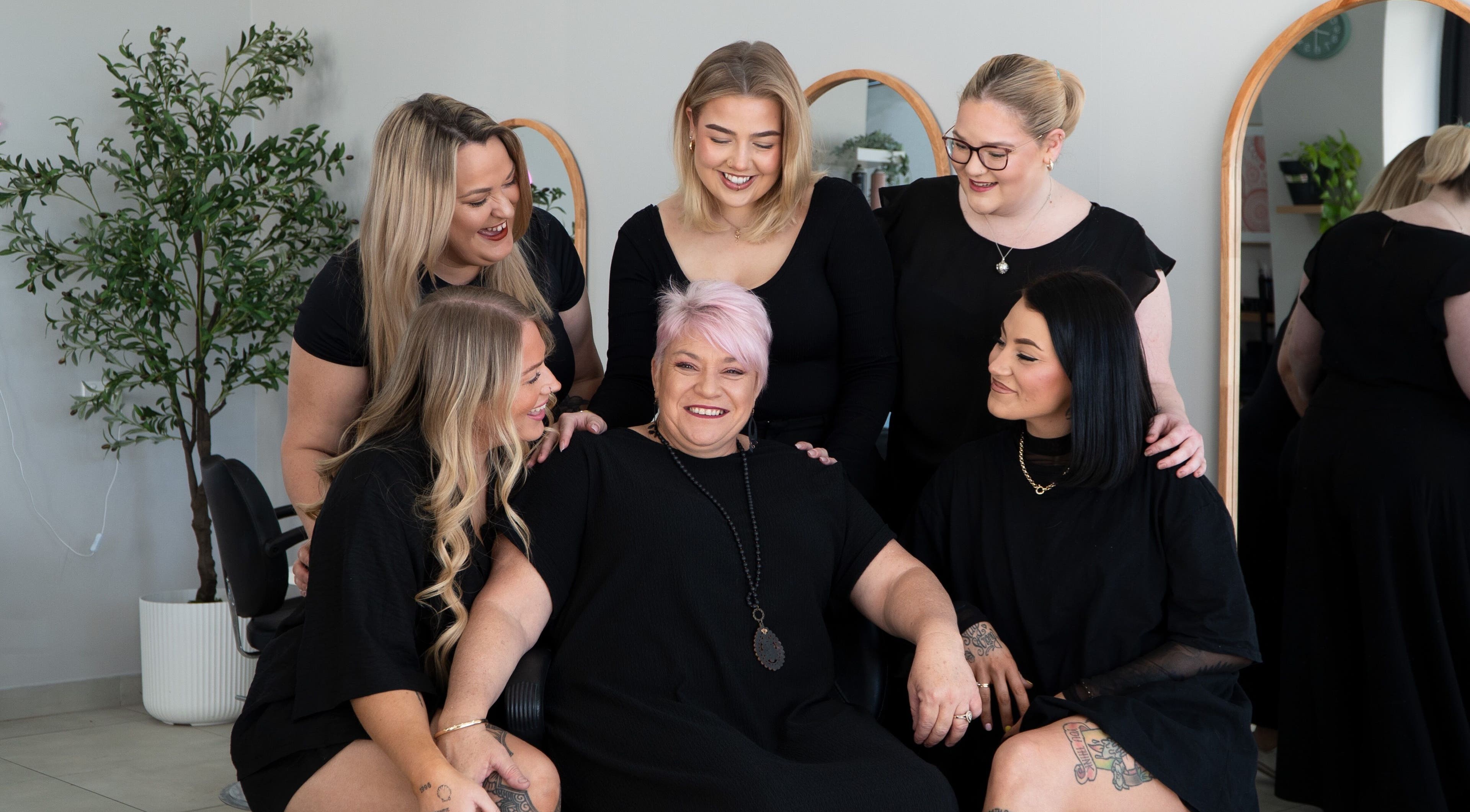 K Thomas Capestone Village team bonding at Mango Hill, Queensland, AU surrounded by mirrors and greenery.