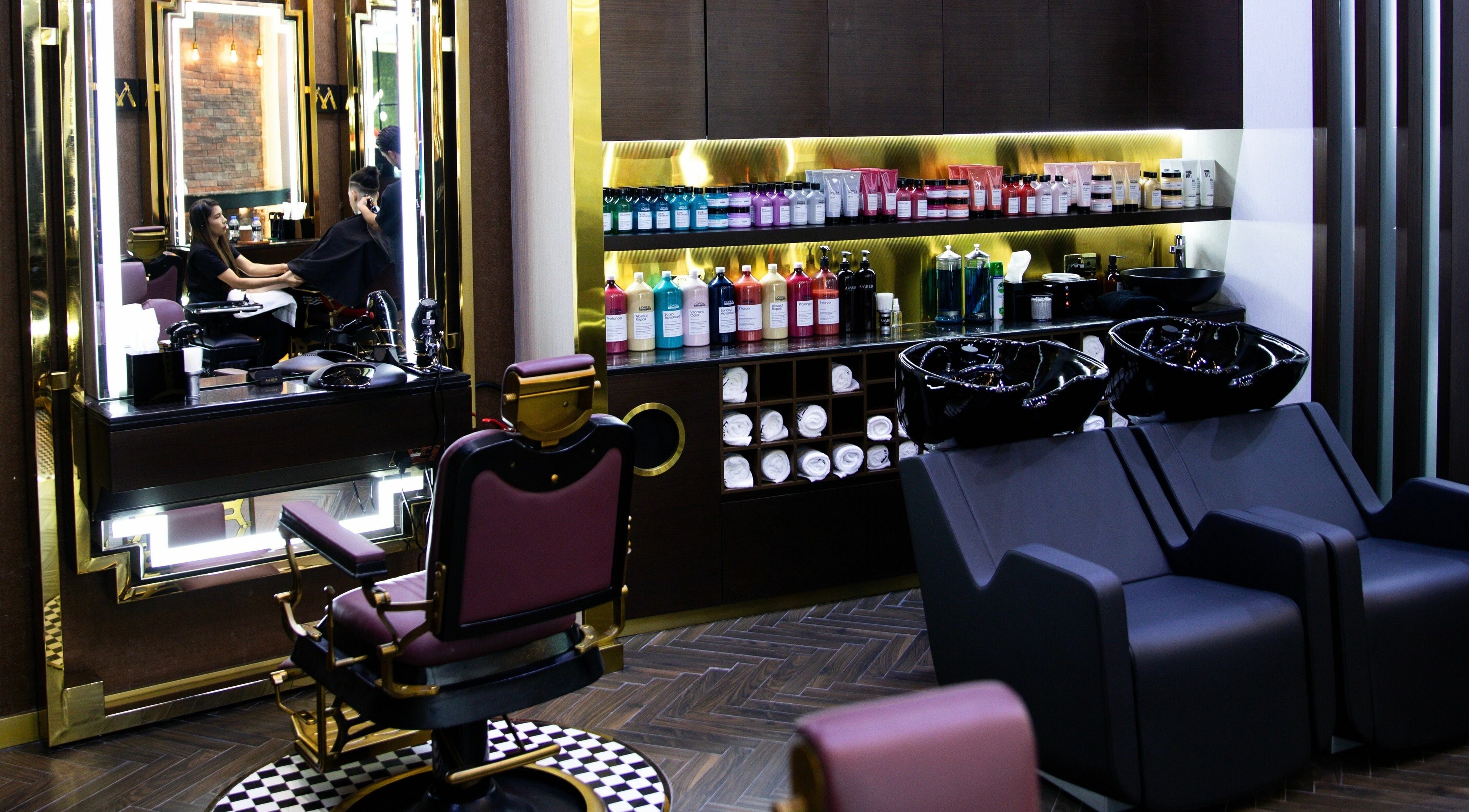 Elegant salon interior at Amber Gents Salon, Two Seasons Hotel, Dubai, Dubai, AE, featuring styling stations.