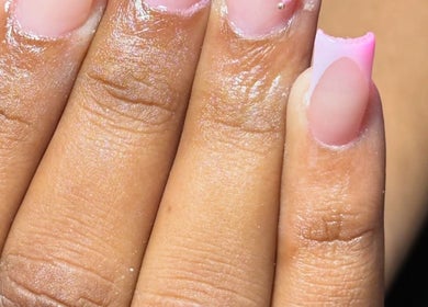 Elegant pink manicure at Nailuxebytasha, Willemstad, CW showcasing detailed nail artistry.