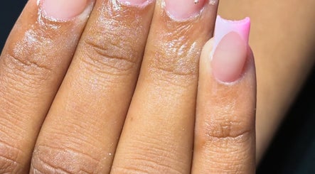 Elegant pink manicure at Nailuxebytasha, Willemstad, CW showcasing detailed nail artistry.