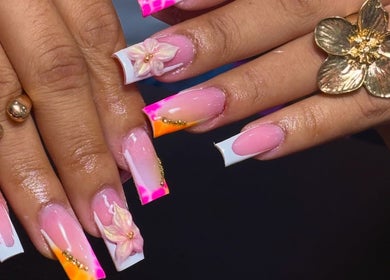 Intricate floral nail design at Nailuxebytasha in Willemstad, CW, showcasing elegant detail and vibrant colors.