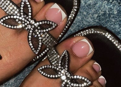 Elegant French pedicure in crystal sandals at Nailuxebytasha, Willemstad, CW.