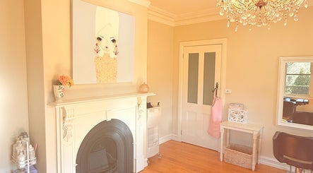 Elegant interior of LaBirdie Hair salon, Frankston Sth, Victoria, AU, featuring stylish decor and chandelier.