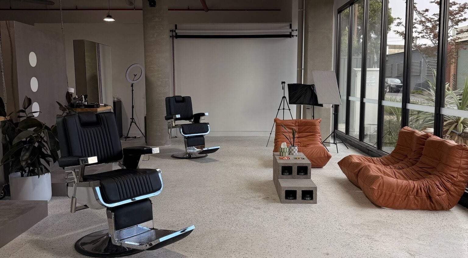 Modern salon setup at Kanati Studios, Airport West, Victoria, AU with stylish chairs and plush seating.