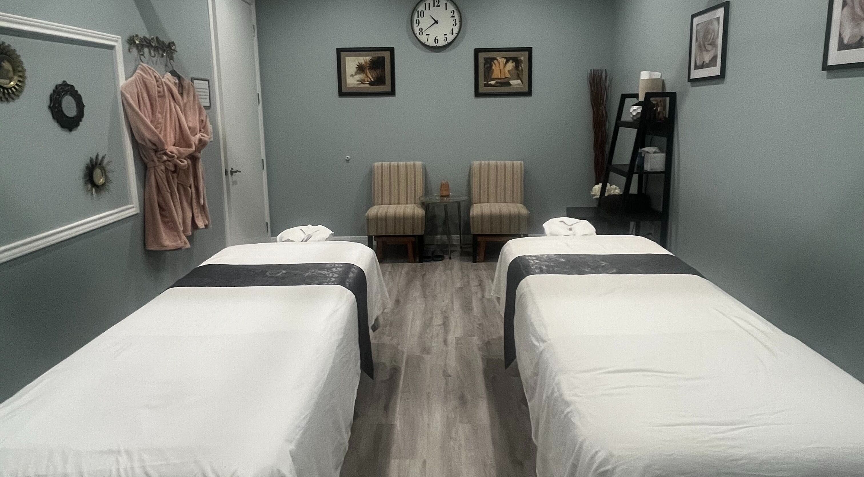 Serene massage room at Oasis Thai Massage in Katy, Texas, US with twin massage tables and cozy decor.