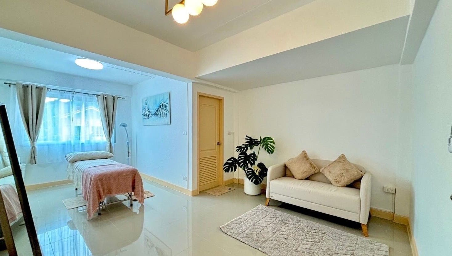 Elegant massage room at Bliss Wax in ตำบล ศรีสุนทร, ภูเก็ต, TH with cozy bed and soft lighting.