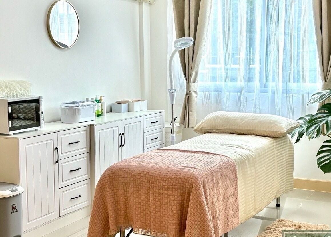 Tranquil treatment room at Bliss Wax, ตำบล ศรีสุนทร, ภูเก็ต, TH, featuring a cozy bed and decor.