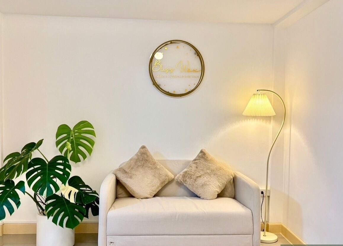 Cozy seating area at Bliss Wax, ตำบล ศรีสุนทร, ภูเก็ต, TH, featuring a plush sofa and elegant decor.