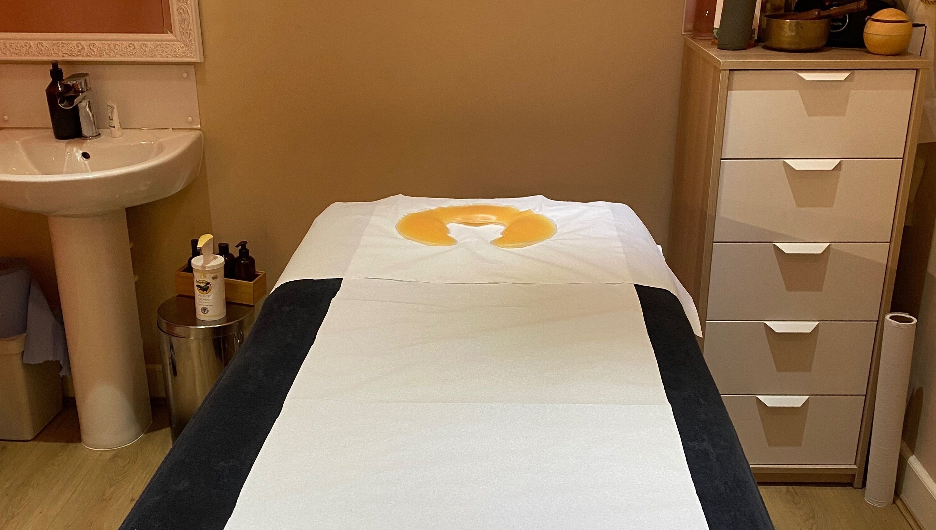 Relaxing massage room at Fibres Sports Massage Therapy, Alcester. Cozy atmosphere with therapy essentials.