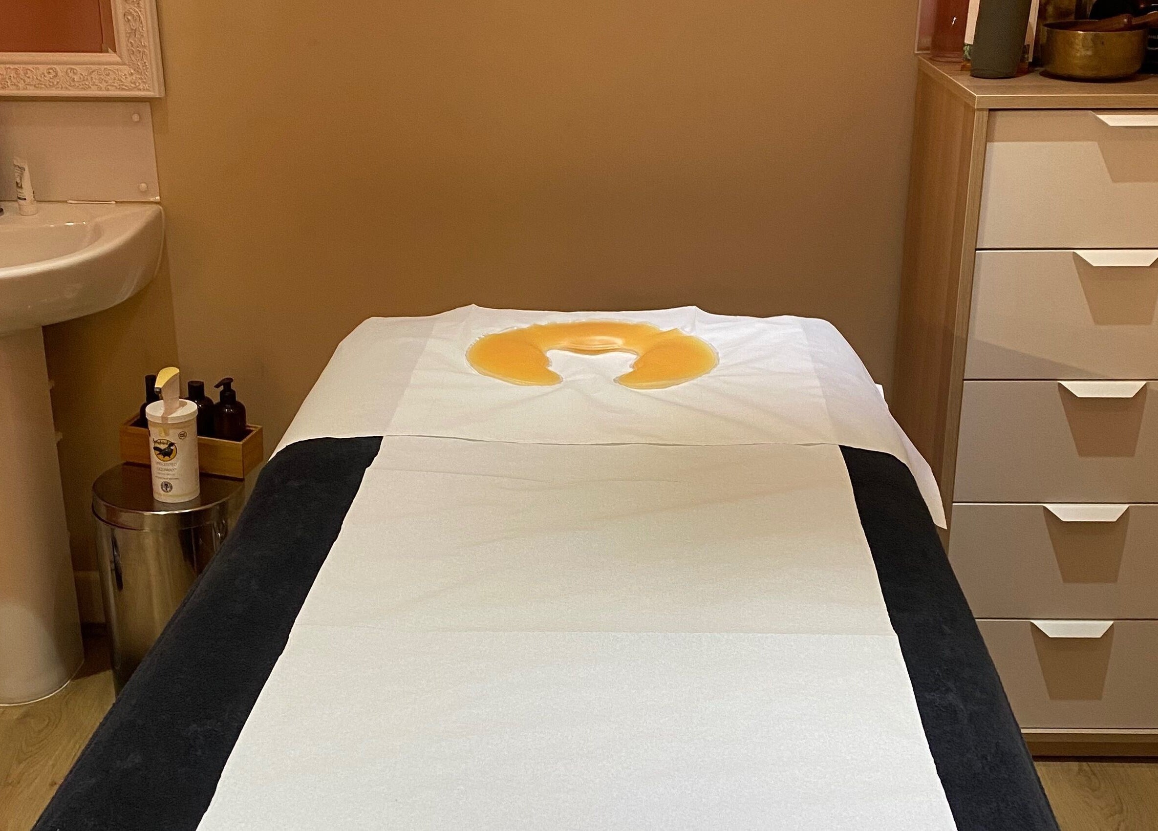 Relaxing massage room at Fibres Sports Massage Therapy, Alcester. Cozy atmosphere with therapy essentials.