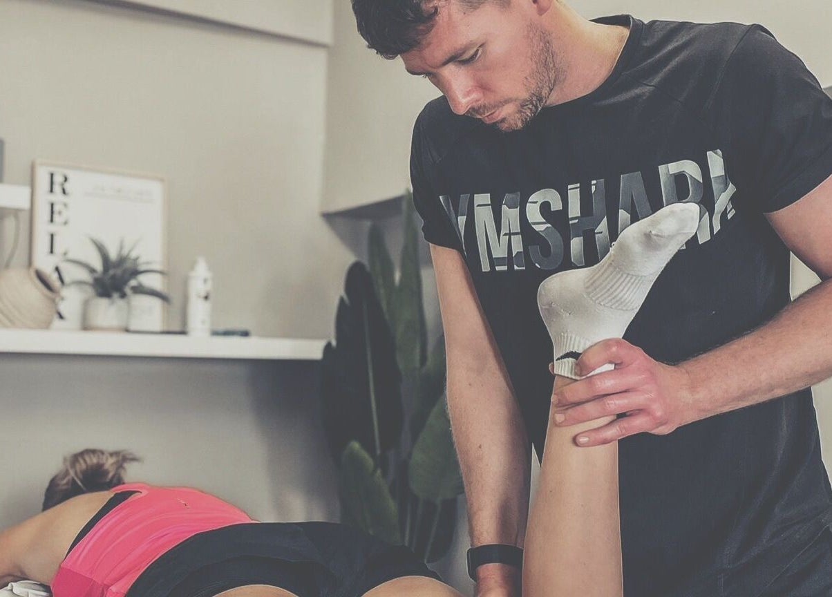 Therapist providing massage at Fibres Sports Massage Therapy in Alcester, England, GB.