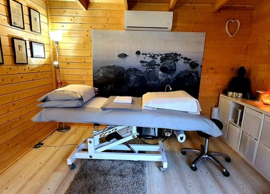 Cozy therapy room at Laura Kitto - LMK Complementary Therapist in Rochester, England, GB with massage table.