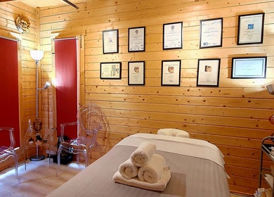 Relaxation room at Laura Kitto - LMK Complementary Therapist in Rochester, England. Cozy wooden decor.