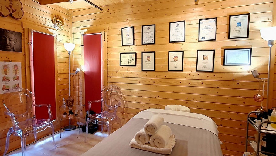 Cozy therapy room at Laura Kitto - LMK Complementary Therapist, Rochester, England, GB with diplomas and ambient lighting.