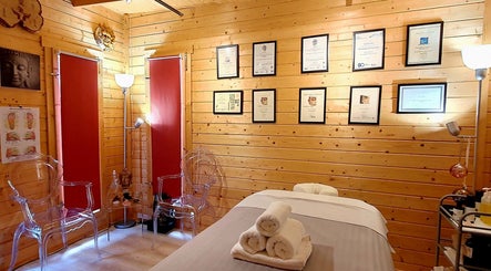 Cozy therapy room at Laura Kitto - LMK Complementary Therapist, Rochester, England, GB with diplomas and ambient lighting.